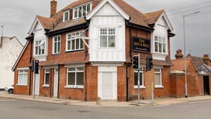 A two-story brick building with a sign reading "The Bat & Ball". - The Bat and Ball (Canterbury)