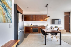 Enjoy cooking in the fully equipped kitchen with an oven, dishwasher, and refrigerator.