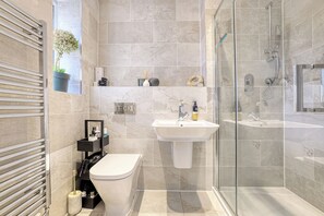 Shower, towels, toilet paper