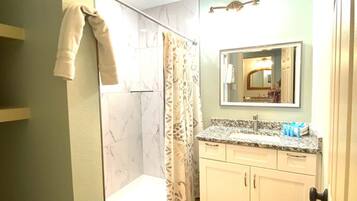 Shower, hair dryer, towels, shampoo