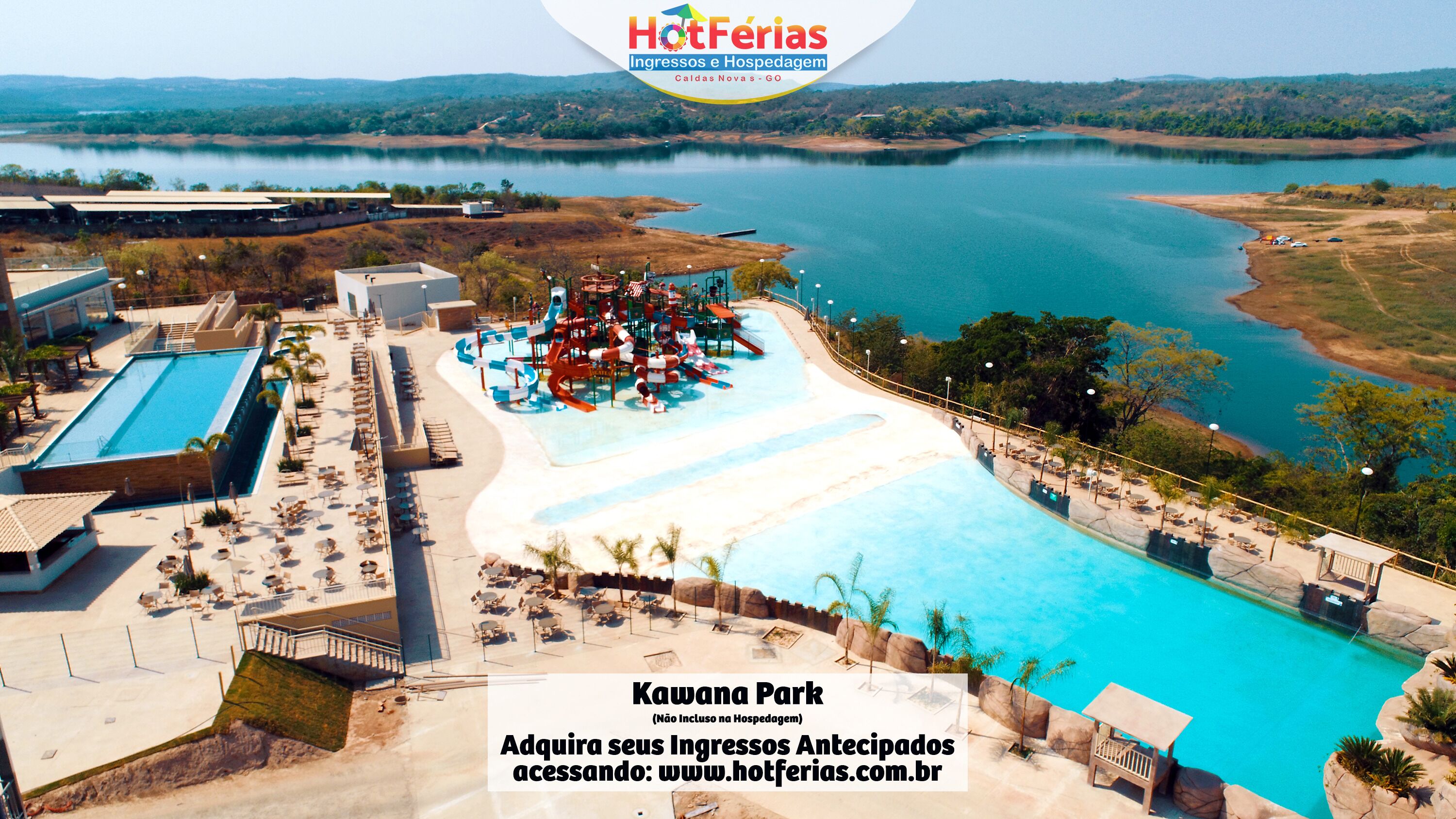 A resort with a large pool, a water park, and a view of a lake.