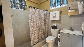 Shower, hair dryer, towels, soap