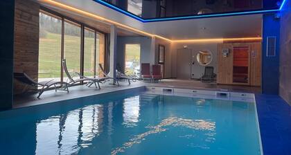Appart-HĂŽtel en Montagne : Piscine, Sauna et Confort pour Toute la Famille