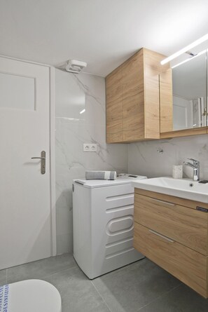 Shower, hair dryer, towels, soap