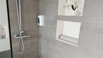 Shower, eco-friendly toiletries, hair dryer, towels