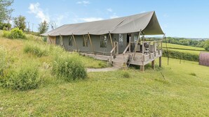 A tented accommodation with a wooden deck and a view of the countryside. - Safari Tent Two - UK44405 (Ross-on-Wye)