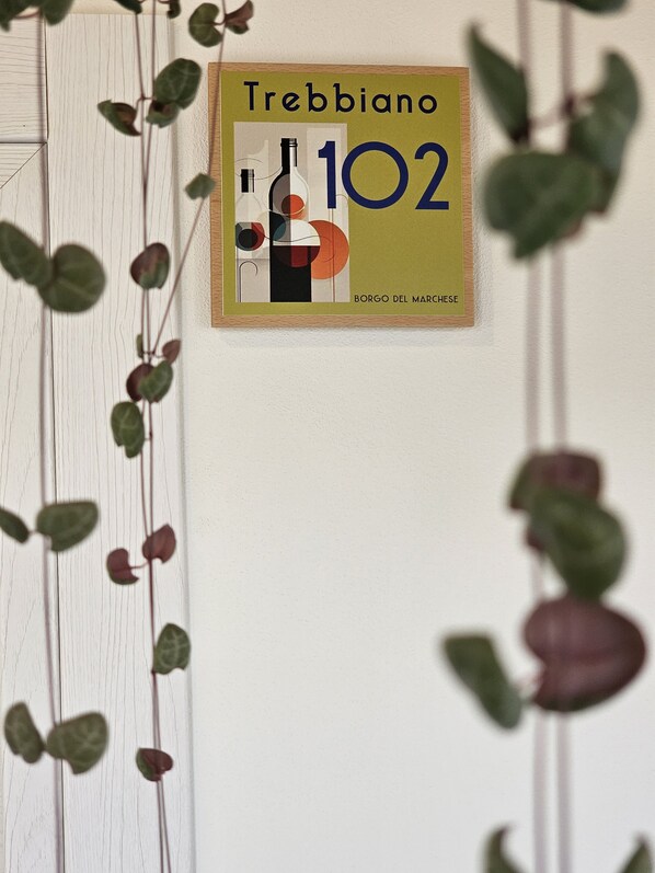 A framed sign with the text "Trebiano 102" and "Borgo del Marchese" on a white wall. - B&B Borgo del Marhese (Ortona)