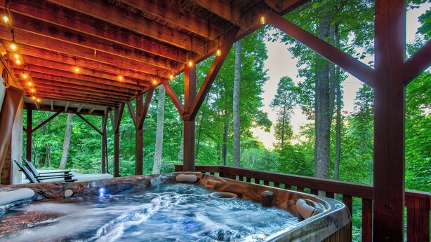 A hot tub in a wooden gazebo with a view of a forest. - Carolina Charm (Banner Elk)