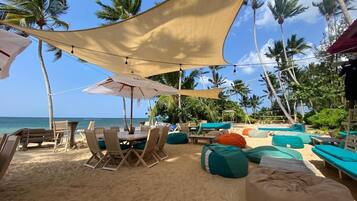 On the beach, sun-loungers