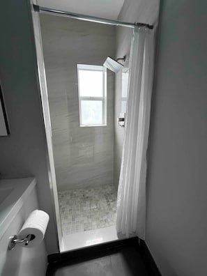 Shower, hair dryer, towels, soap