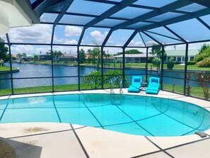 Outdoor pool, a heated pool - SENSATIONAL!! WATER-VIEW, LUXURY REMODEL, SUNNY HEATED POOL, HUGE 145’ SEA WALL (Punta Gorda)