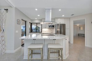 Fridge, microwave, oven, stovetop - SENSATIONAL!! WATER-VIEW, LUXURY REMODEL, SUNNY HEATED POOL, HUGE 145’ SEA WALL (Punta Gorda)