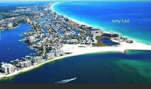 Jetty East hotel sits along the shoreline, offering stunning coastal views.
