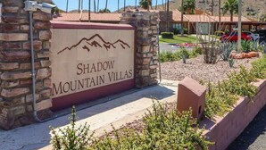 A sign for Shadow Mountain Villas with a mountain graphic. - 2BR Condo with patio, Heated Pool, Spa & Gym Access (Phoenix)