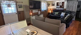 Camp Bear Bottom is a lovingly kept 1950s cabin where families gather to unplug and reconnect. Step inside to find an inviting indoor fireplace, fast Wi-Fi, and a fully equipped kitchen ready for your favorite recipes.