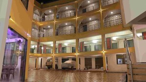 A multi-story building with a courtyard. - JK Sea Palace (Shrivardhan)