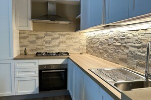 Fridge, oven, dishwasher, dining tables