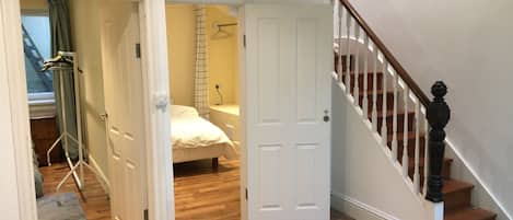 Stairs up from bedrooms to kitchen diner