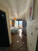 Deluxe Double Room, Sea View | Premium bedding, minibar, in-room safe, individually decorated