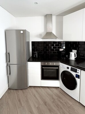 Fridge, microwave, oven, stovetop - Urban Two Bedroom Apartment (Gibraltar)
