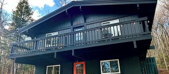 Pet-friendly winter retreat in the woods with fireplace near Okemo + Killington