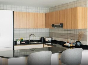 Fridge, microwave, stovetop, coffee/tea maker