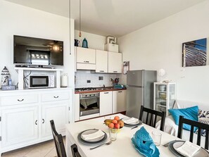 Microwave, high chair, dining tables