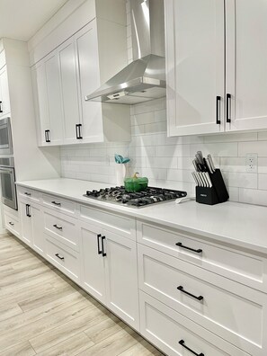 Fridge, microwave, oven, stovetop - Livingston Gem: 5BR Home with Chef's Kitchen (Calgary)