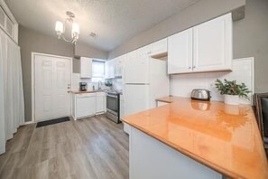 Fridge, microwave, oven, stovetop - Right at Home-Uptown Place with gated yard and covered parking (Midland)