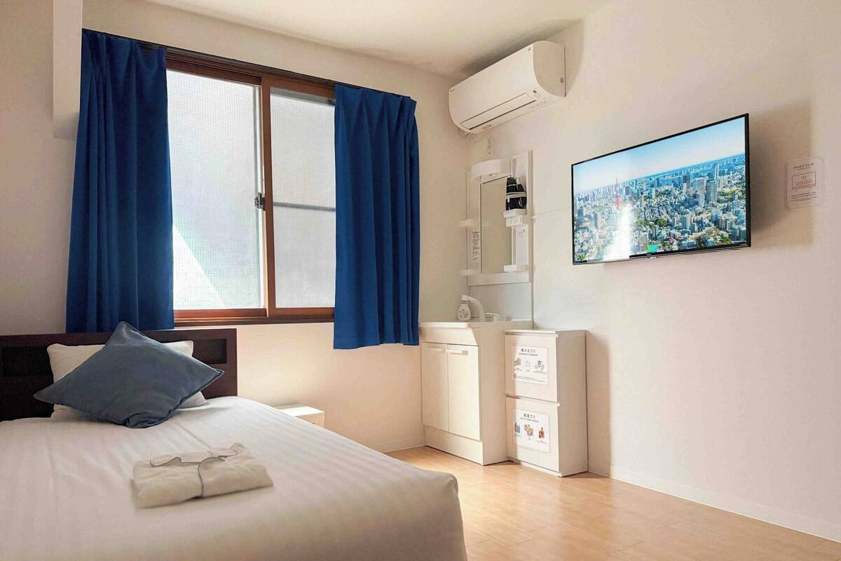 Desk, laptop workspace, blackout curtains, free WiFi