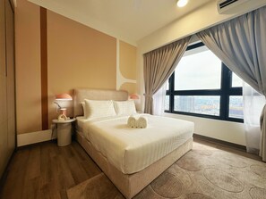 A hotel room with a large bed, two bedside lamps, a view of the city through a large window, and a modern design. -  Agile Bukit Bintang TRX by Dormeo Destinations (Kuala Lumpur)