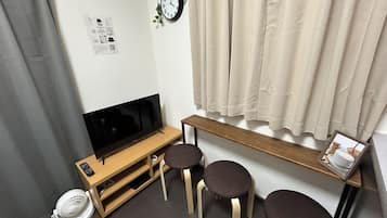 Basic Apartment, Lanai, City View | Desk, laptop workspace, blackout drapes, iron/ironing board