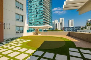 A modern building with a rooftop garden featuring geometric patterns and a central planter. - Miami Vice, Chic, Pool and Steps to Midtown Shops (Miami)