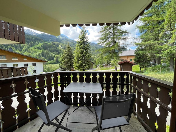 Enjoy breathtaking views of the surrounding mountains from this balcony.