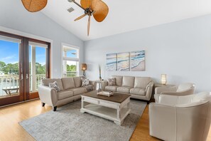 House, Multiple Beds, Pool Access (8506 Lydia Ln) | Living area | 50-inch flat-screen TV with cable channels, TV - Beach Bay Getaway! Bayfront 4BR 4BA House Sleeps 12 Private Pool Boat Dock (Panama City Beach)