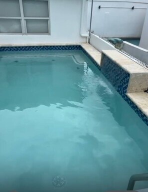 Outdoor pool - Modern Condo, Kitchen, 1 Block Walk to Beach! (San Juan)
