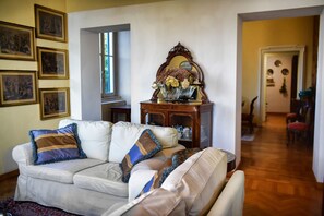 Apartment, Lake View | Living area | 35-inch TV with digital channels
