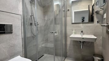 Shower, rainfall showerhead, hair dryer, towels