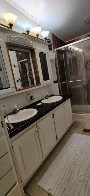 Shower, eco-friendly toiletries, towels, soap