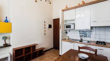 Apartment | Living area | 30-inch flat-screen TV with digital channels
