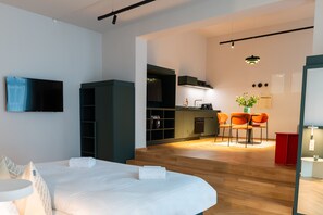 Comfort Studio | Living area | 50-inch flat-screen TV with satellite channels