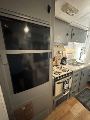 Fridge, coffee/tea maker, toaster, cookware/dishes/utensils
