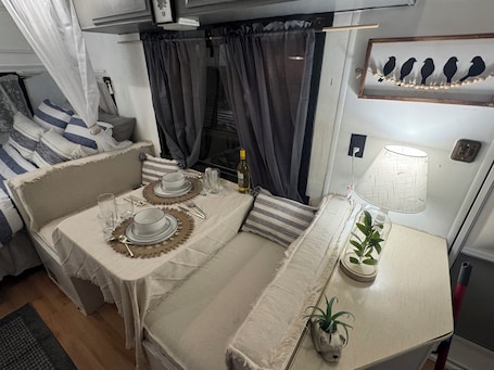 1 bedroom, bed sheets. Vintage Vibes: Quaint Camper Escape