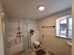 Shower, hair dryer, towels, soap