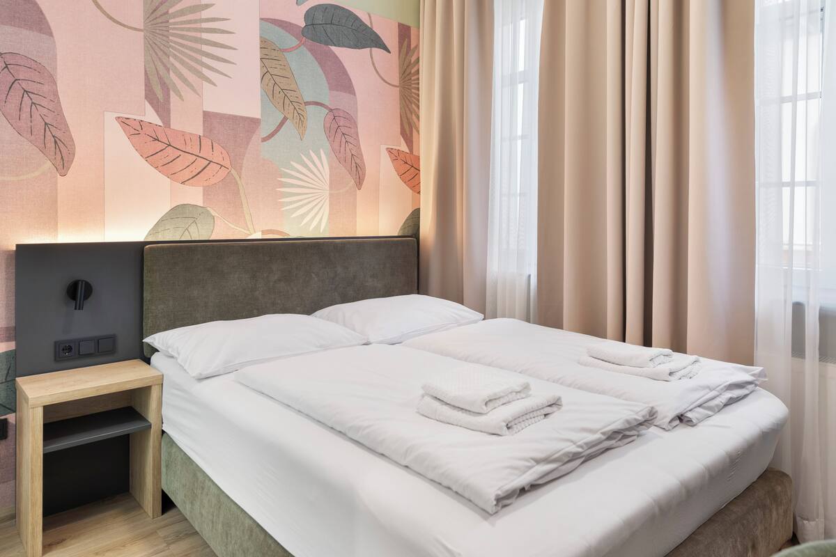 Junior Double Room, Non Smoking, Private Bathroom | In-room safe, individually decorated, individually furnished, desk