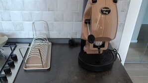 A kitchen with a coffee machine, a utensil organizer, and a gas stove. - Torre del Greco waterfront apartment - 6 floor with panoramic view  (Torre del Greco)