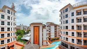 A modern hotel complex with multiple buildings, a central pool area labeled 'New Nordic', and a small building with a sloped roof. - New Nordic Trend 5 by Apartwell (Pattaya)
