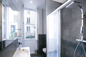 Shower, eco-friendly toiletries, hair dryer, towels