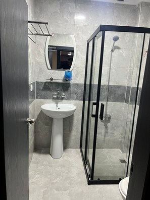 Shower, free toiletries, hair dryer, slippers