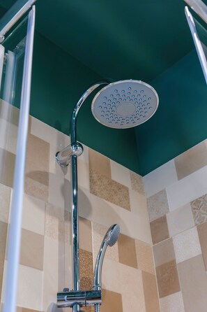Family Suite, Balcony, City View | Bathroom | Shower, free toiletries, hair dryer, slippers